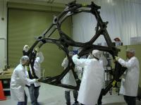 Scientists Working with the Backplane of the JWST