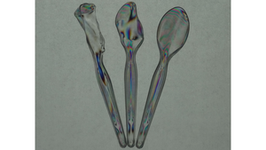 The stochastic stress-induced birefringence within plastic spoons left in the hot sun is visualized through polarization-filtered coloration