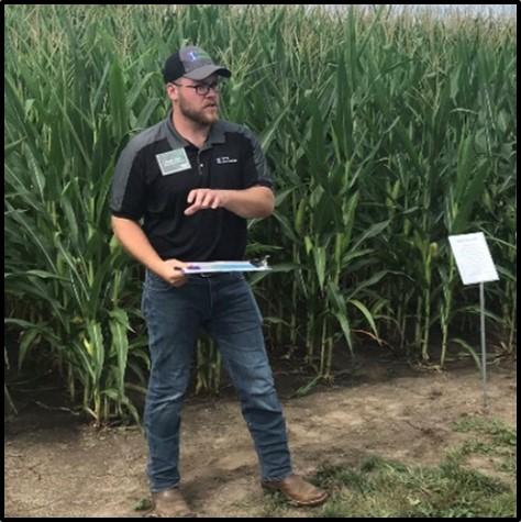 Connor Sible presenting research at a field day