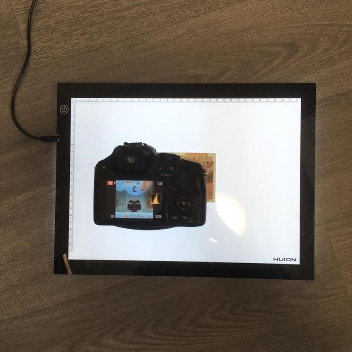 Using a camera and a light box to identity the note