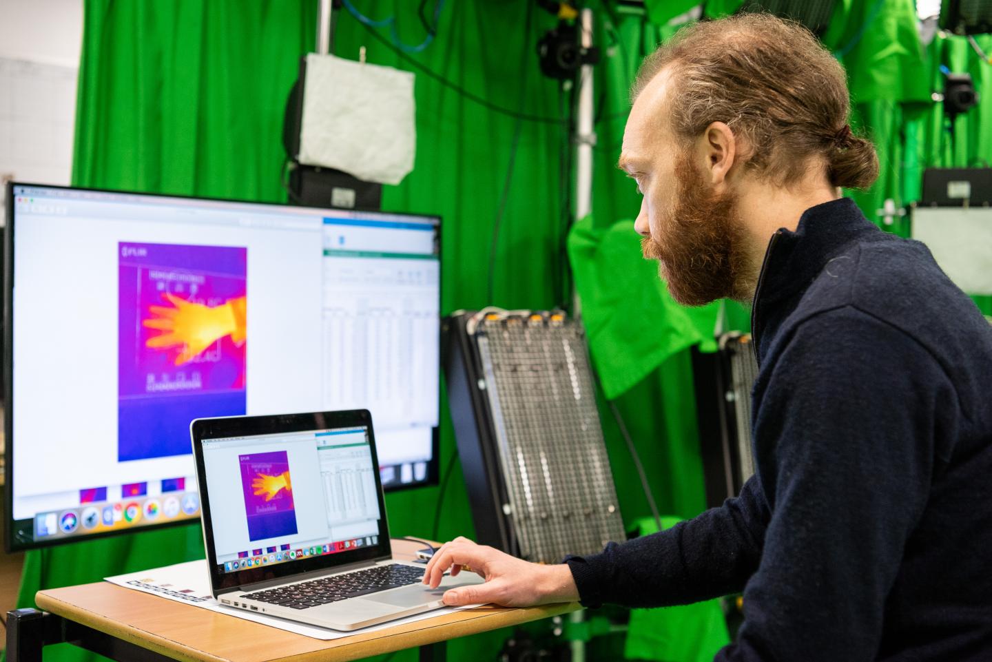 Researcher Analysing Thermal Imaging Data