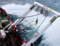 A deep diving ocean robot is deployed in the Southern Ocean in rough weather from the South African Ice Breaker