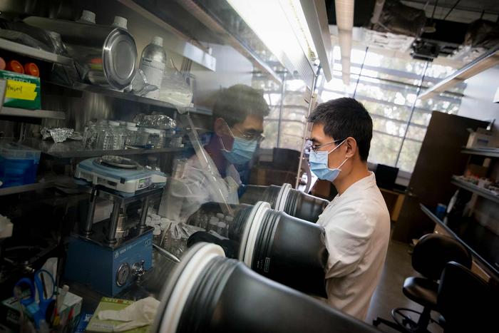 A researcher working in a lab at NSF's Materials Research Science and Engineering Center at UC San Diego