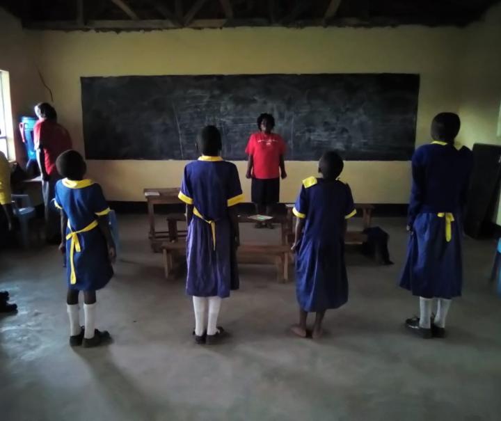 Counselor Leads Therapy Session in Kenyan School