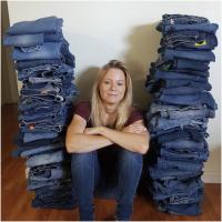 Study Author Sophie Nightingale with the 100 Pairs of Blue Jeans Used in the Study