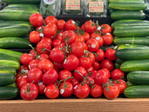 A tomato in a grocery store