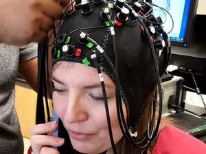 University of Houston researcher Stacey Gorniak dons the neuroimaging device used in the study