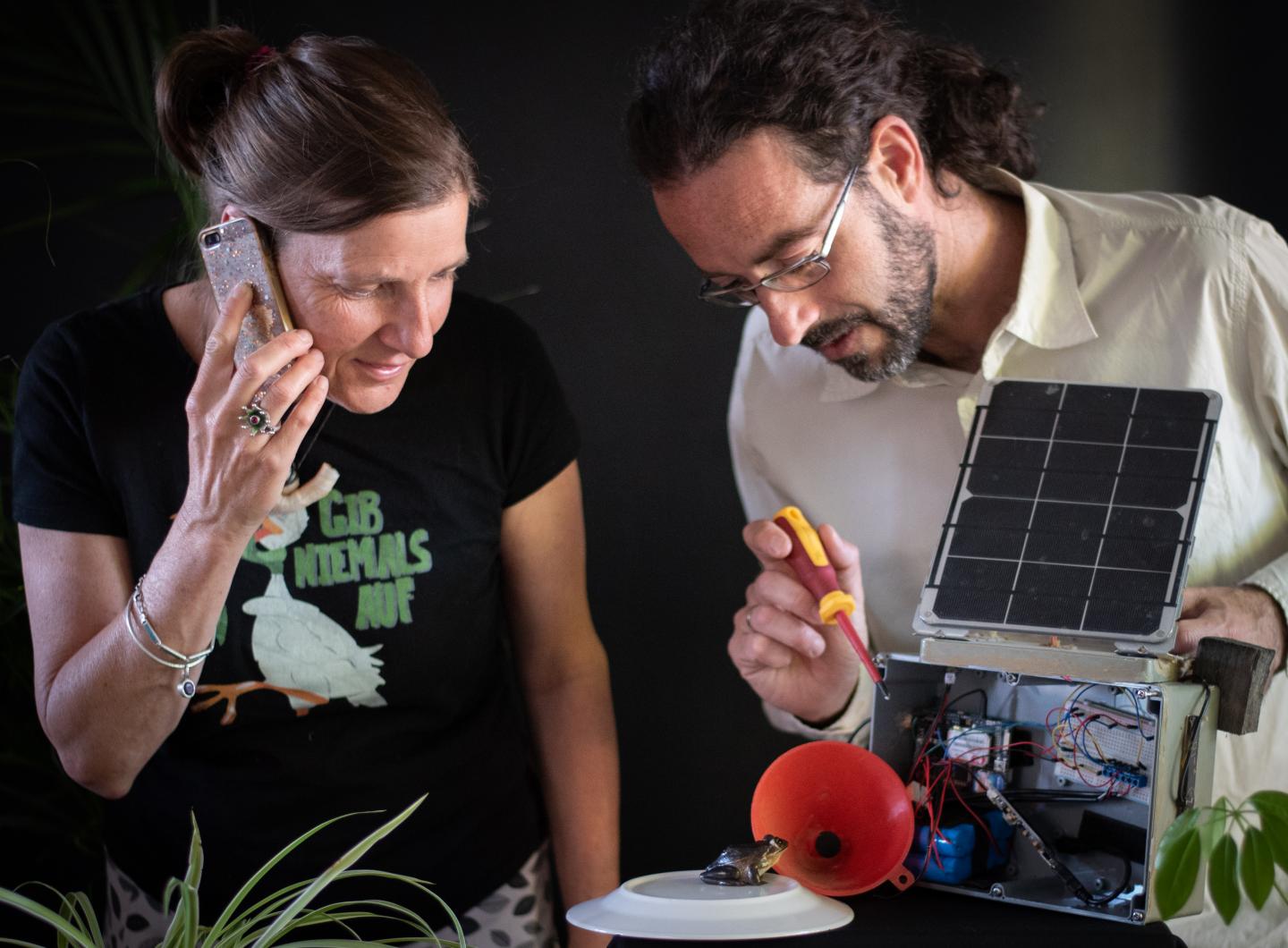 Researchers Anke Marie Hoefer and Adrian Garrido Sanchis test the FrogPhone