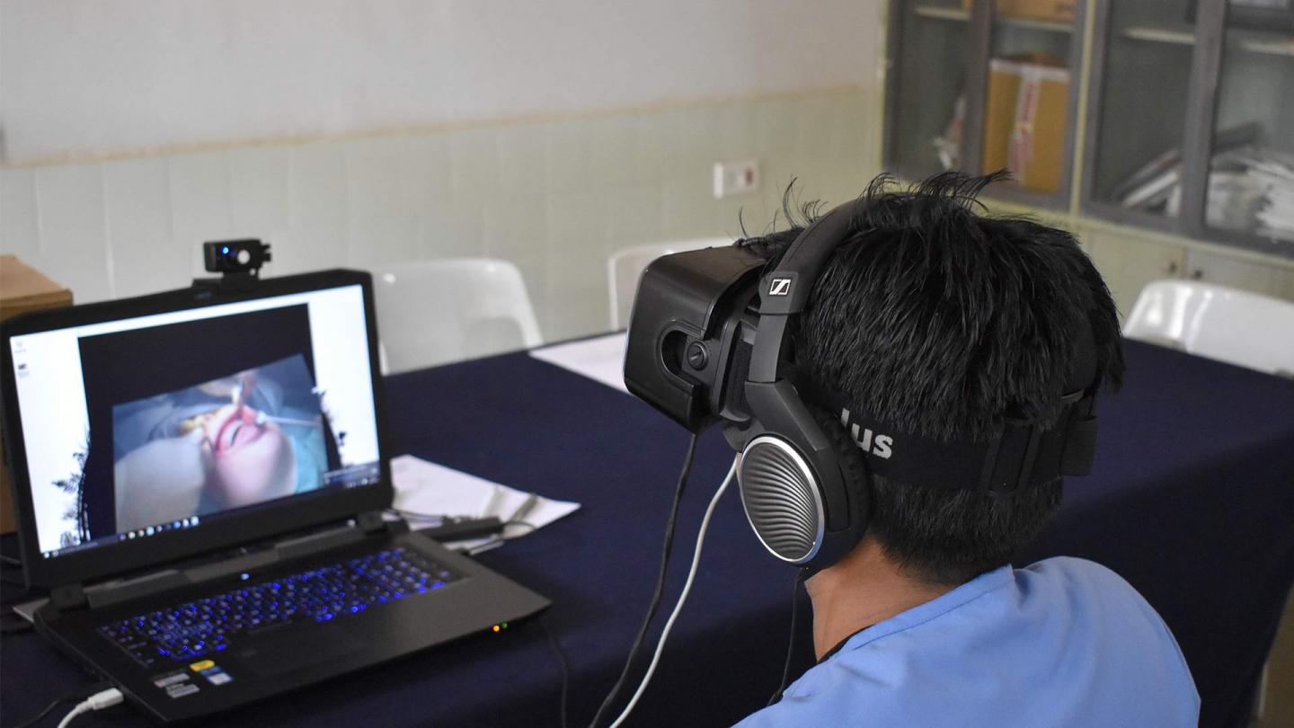 A dental student with VR headset