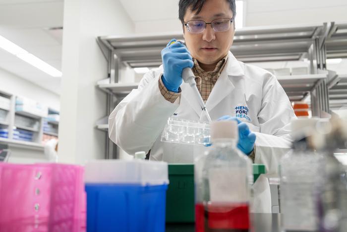 Ling Huang, Ph.D. performs research work