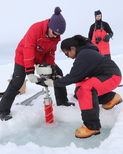 Scientists taking ice core samples