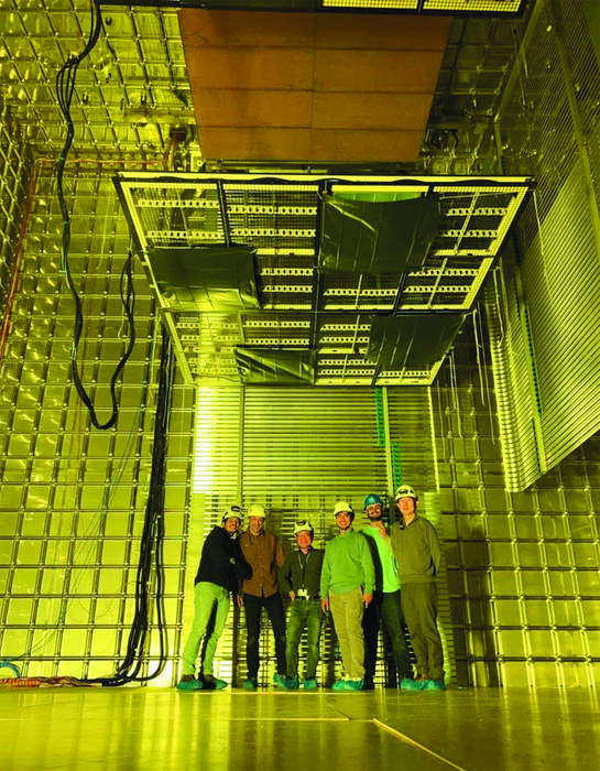 Physicists shown at CERN inside the prototype detector