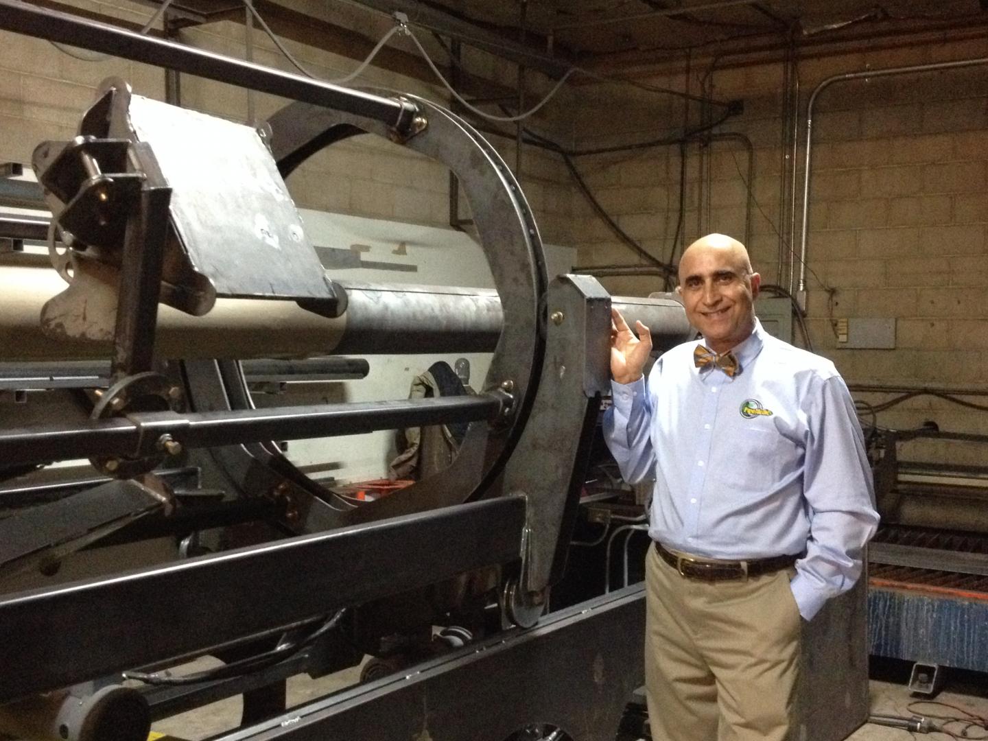 Prof. Mo Ehsani with InfinitPipe Machine, QuakeWrap, Inc. 
