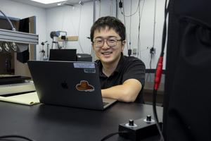 Dongyi Wang with computer