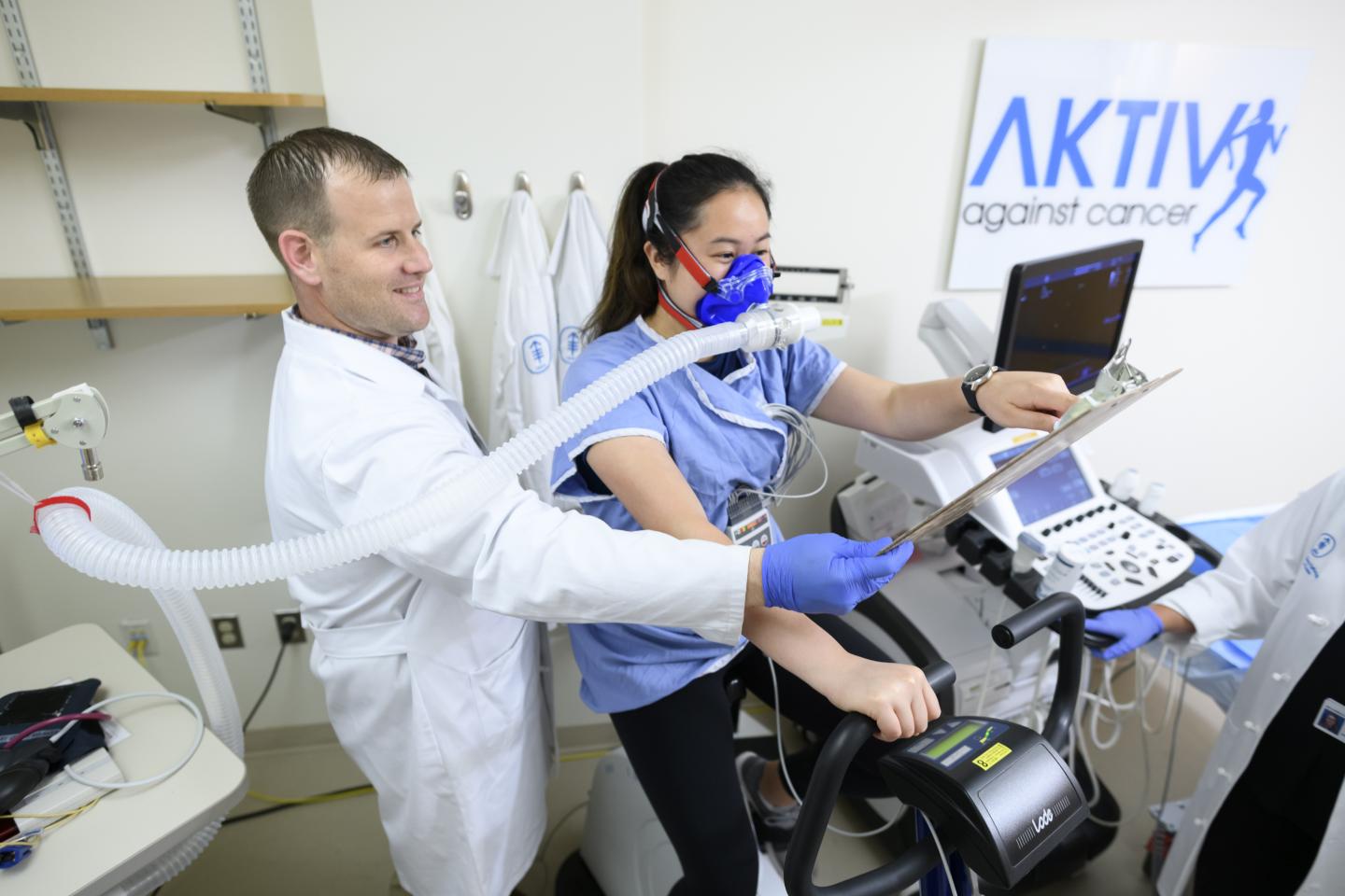 Physiologist Conducts Cardiopulmonary Exercise Test on Patient