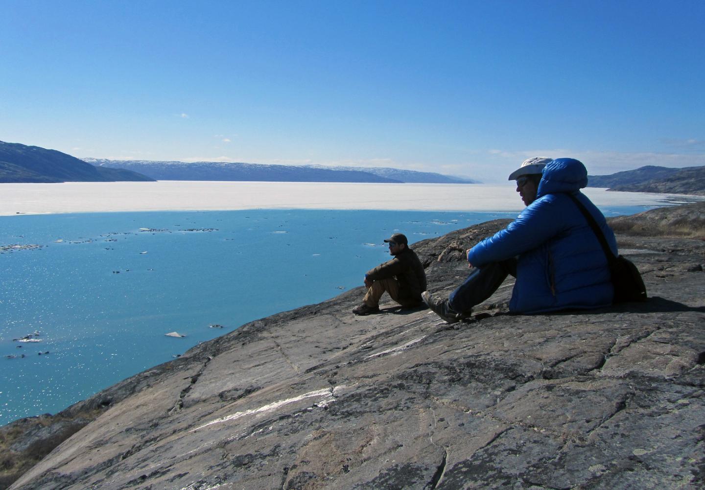 Researchers Look across Sondre Stromfjord outside Kangerlussuaq, Greenland