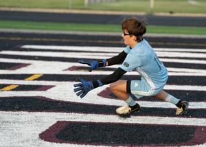 Enzo Servedio, 15, blocks a shot on goal during soccer practice.