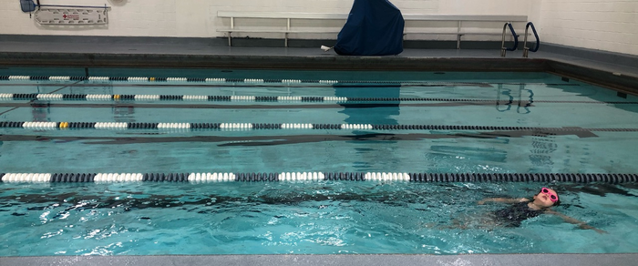 Child swimming laps  in pool