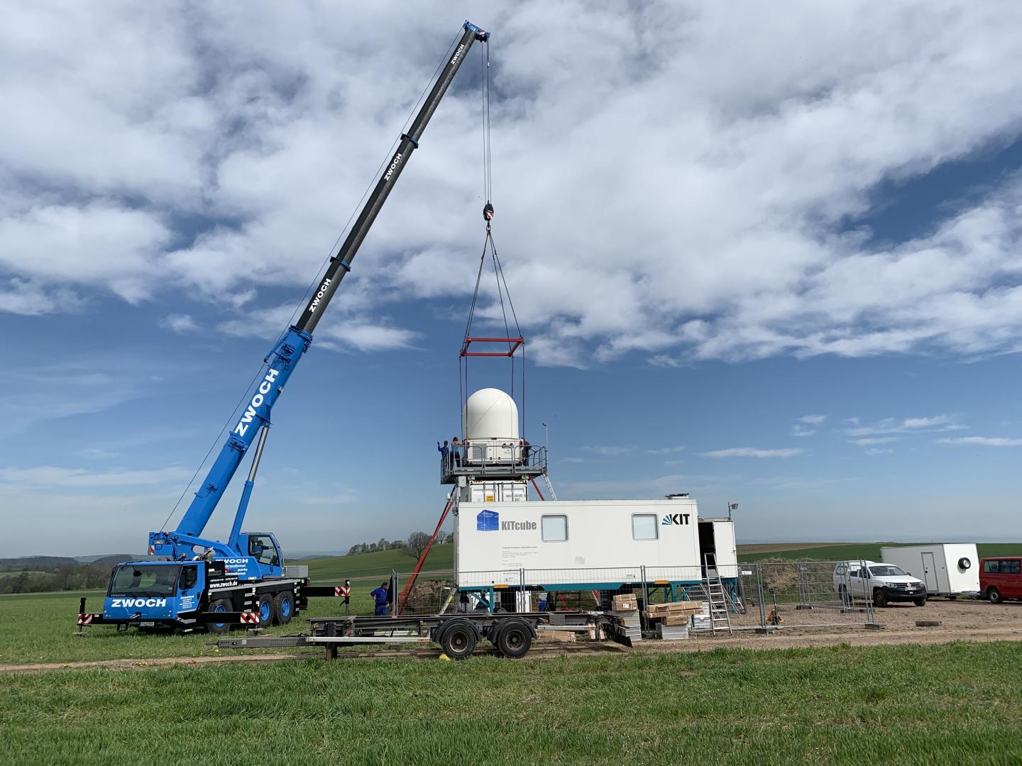 KITcube Mobile Measurement Facility: with the Help of a Truck Crane, the Precipitation Radar Is Inst