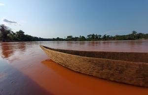 Canoe floating in the Loange River near the port of Kabombo