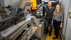 Scientists stand before reflectometer