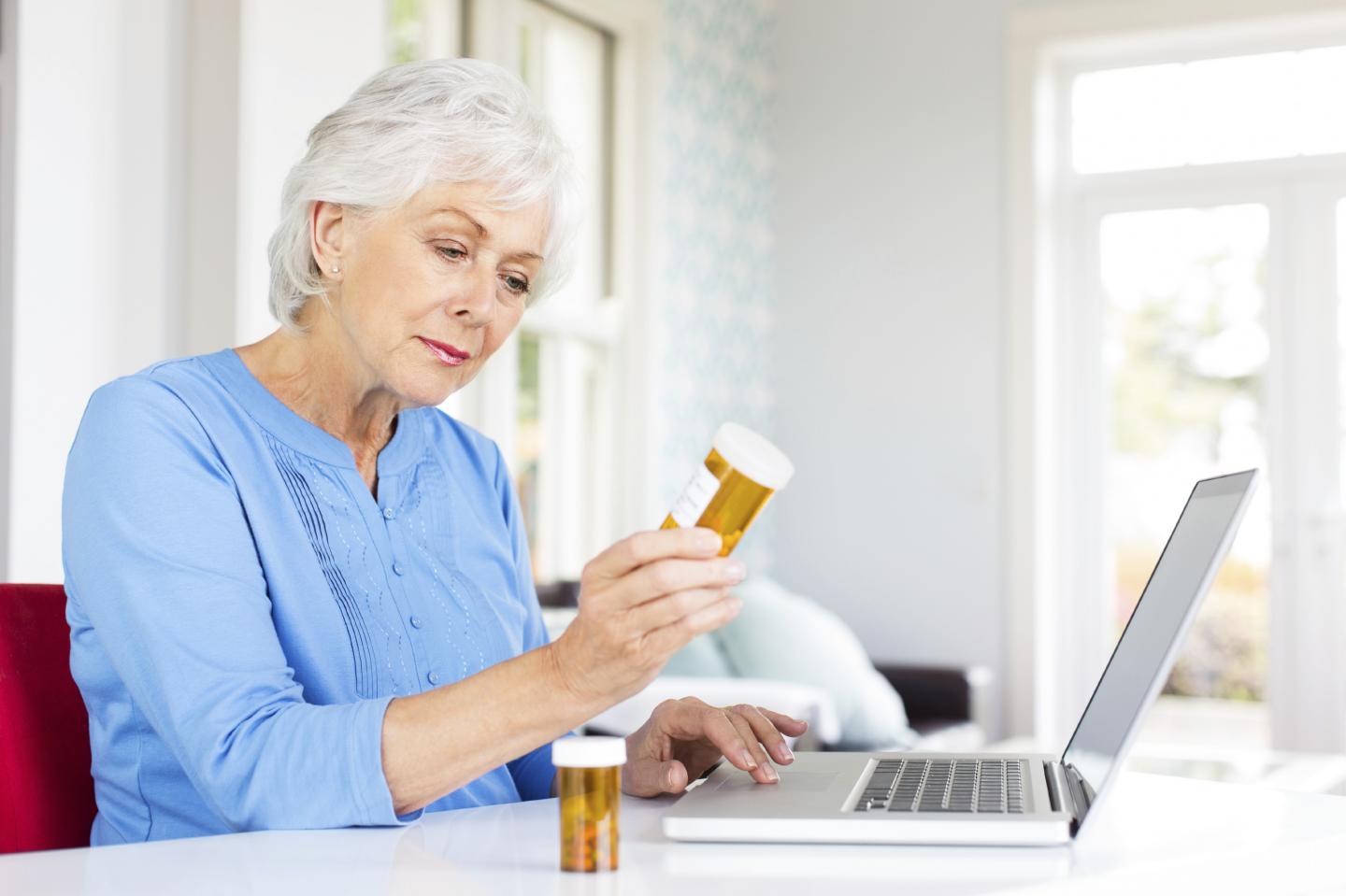 An Older Woman Researching Drug Information Online
