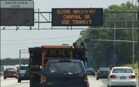 Cars on Highway and Display Showing Ozone Advisory
