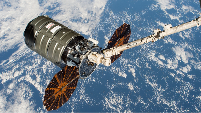Cygnus spacecraft in the grip of the International Space Station