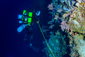 Hope for Reefs diver conducting a transect at depth
