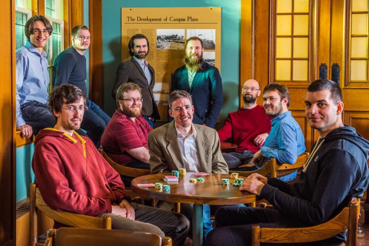 Michael Bowling (center) Flanked by Co-Authors of DeepStack