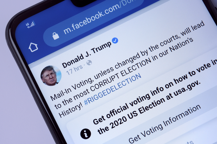 Facebook post by Donald Trump RIGGED ELECTION with a newly introduced Facebook post label. Facebook labels Trump posts on voting in US 2020 election. Stone, UK - July 22 2020