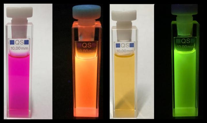 bottles of liquid with fliud/glowing fluid with different colours