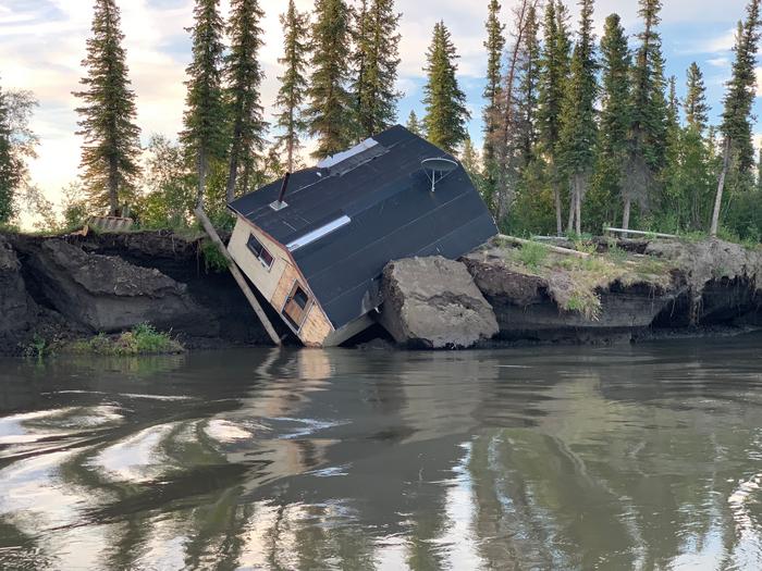 Infrastructure in permafrost areas is threatened by river bank erosion, Mackenzie River Delta, Canada.