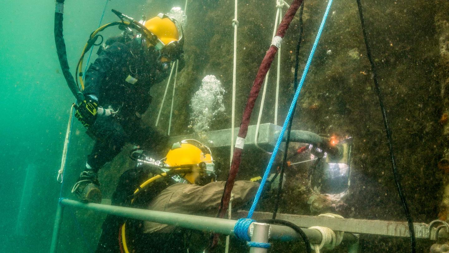 Divers Install An Anode