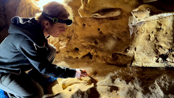 Geologists At Work In Cave