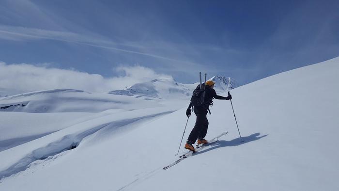 OSU civil engineering professor David Hill carries a snow coring device uphill near Thompson Pass, Alaska. Photo by Ryan Crumley.