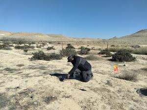 Researcher setting up field experiment