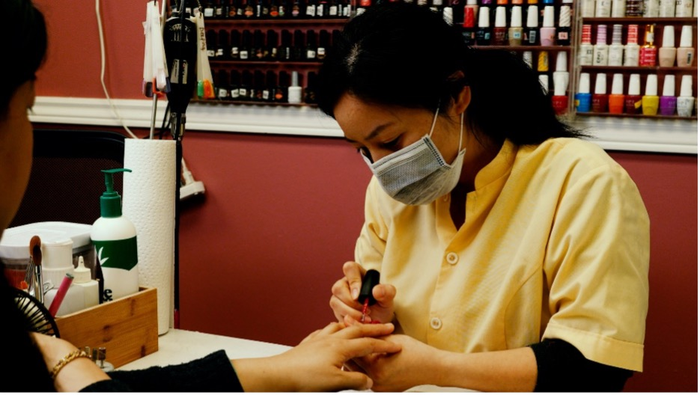 Jackie Liang working in a Toronto nail salon