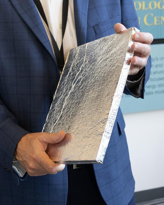 Partnerships Director Mike Paulus holds a vacuum insulation panel