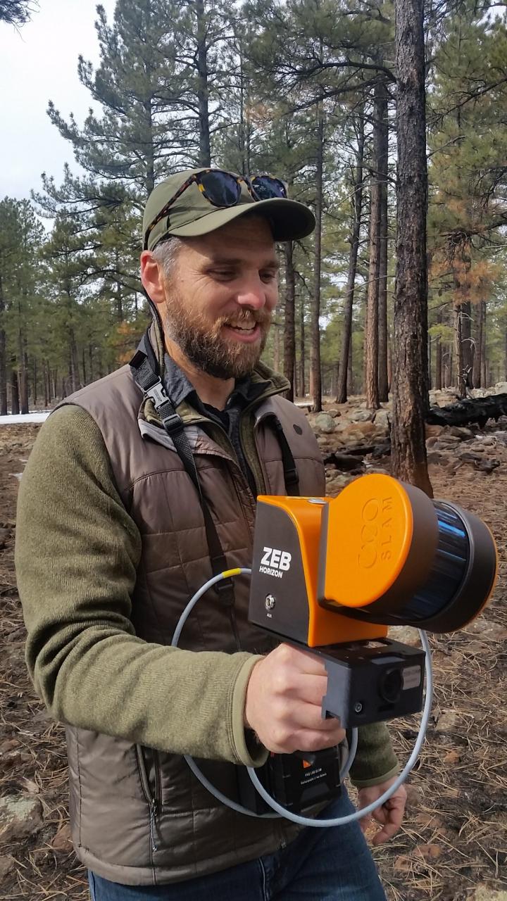 Researcher using handheld MLS