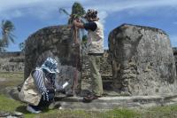 Project staff recording a stone defensive fortification built by Iskandar Muda along the Aceh coast.