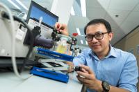 Dr. Ng with his Testing Apparatus