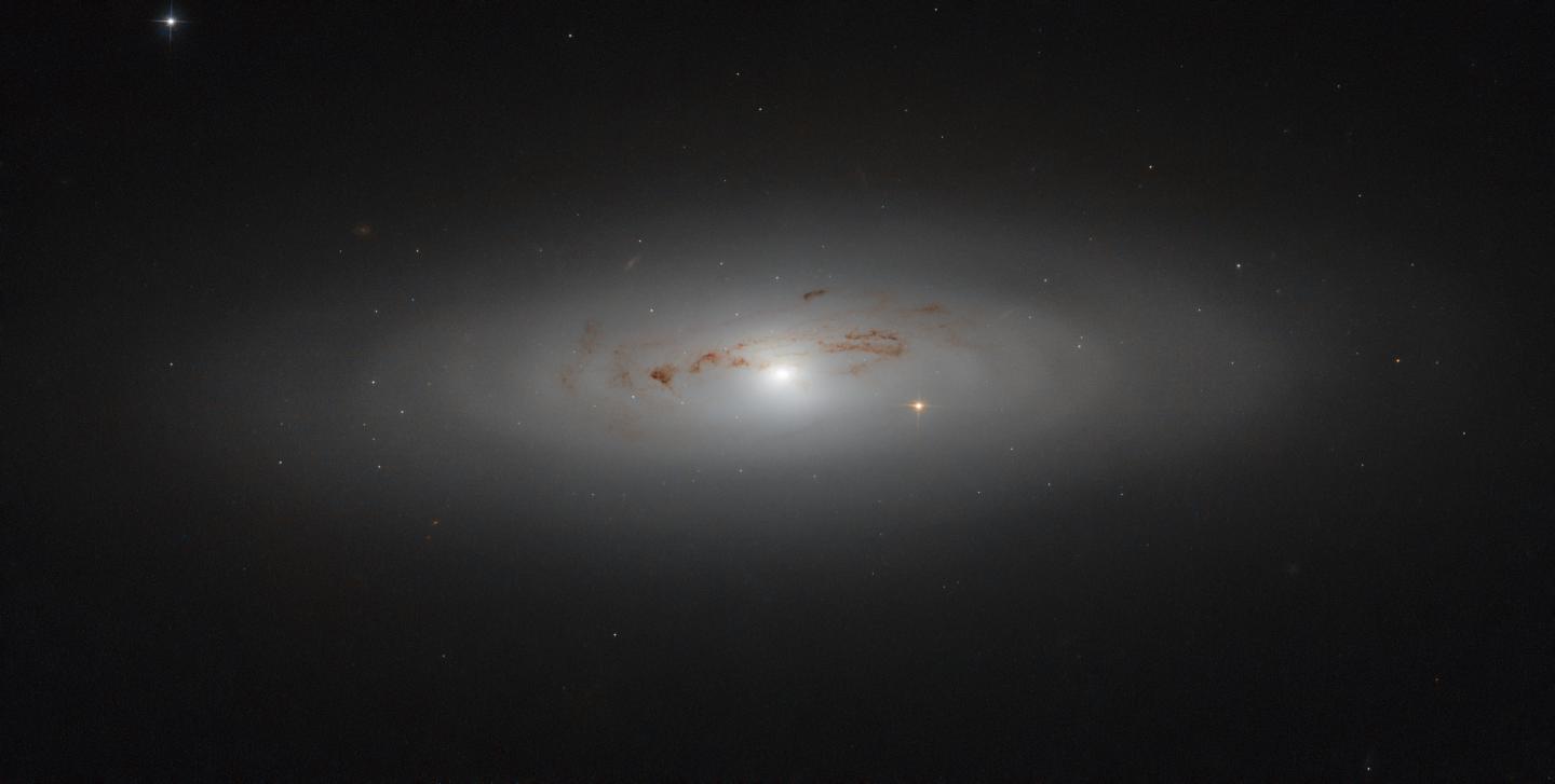 Hubble Peers into a Galaxy's Dusty Haze