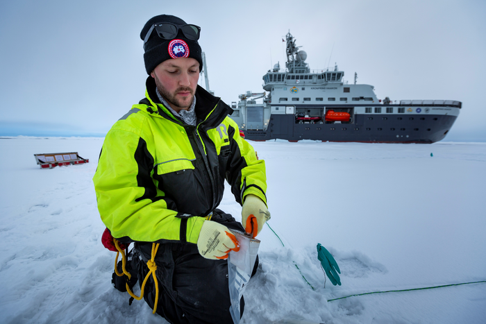 Dr Jack Garnett on the research expedition in the Arctic. Pic credit ‘Christian Morel / www.christianmorel.net / The Nansen Legacy’.