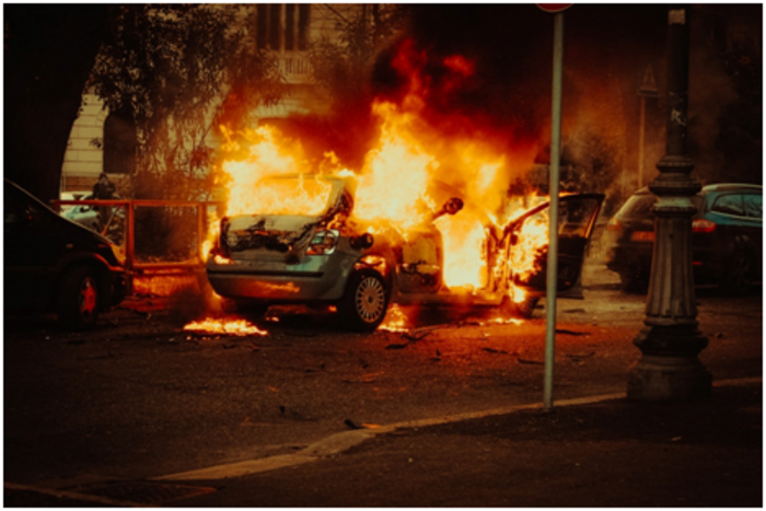 Stock image of a container burning in the street