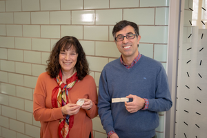 WPI researchers Nima Rahbar and Suzanne Scarlata hold up samples of their enzymatic construction material