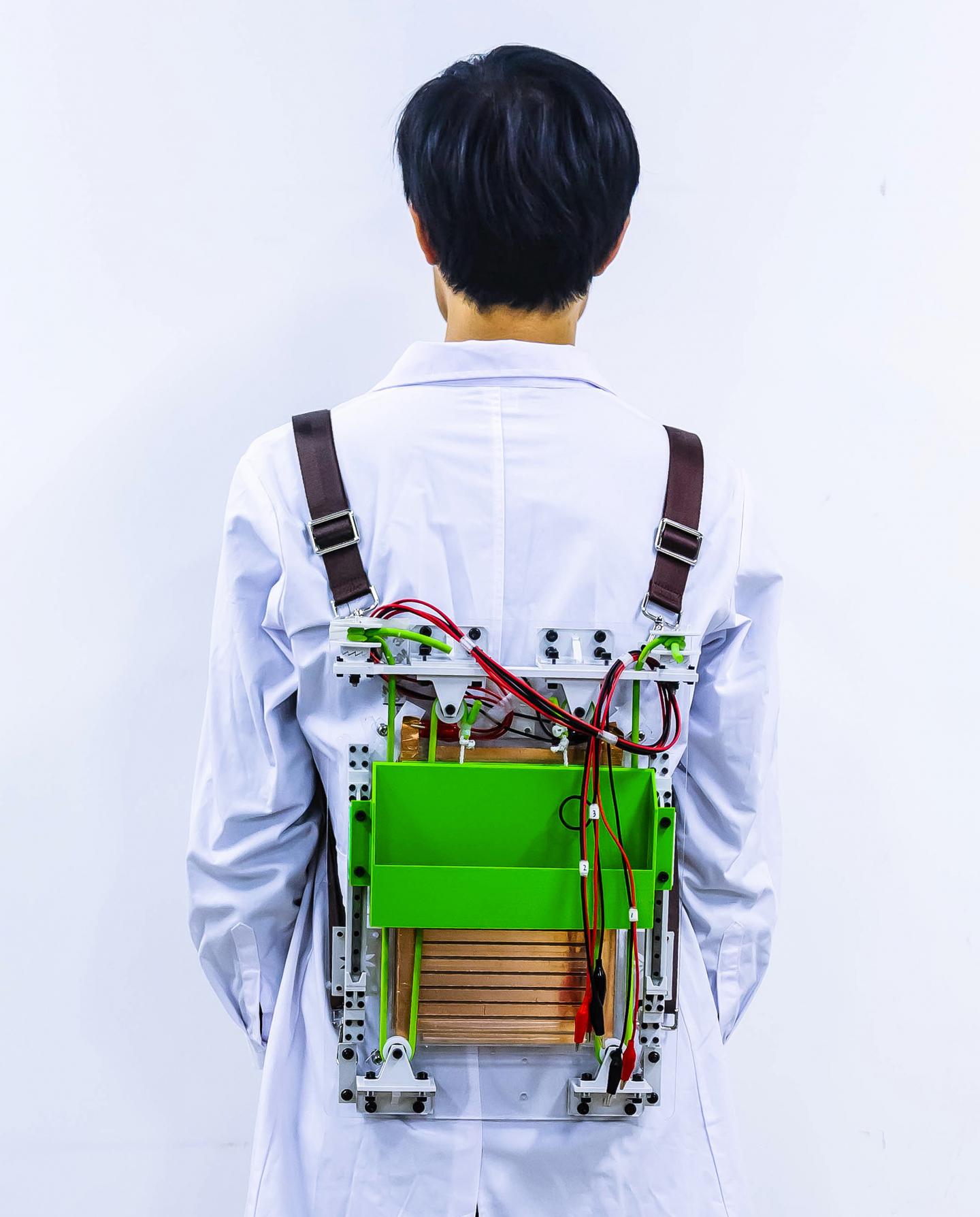 Load-reducing backpack powers electronics by harvesting energy from walking