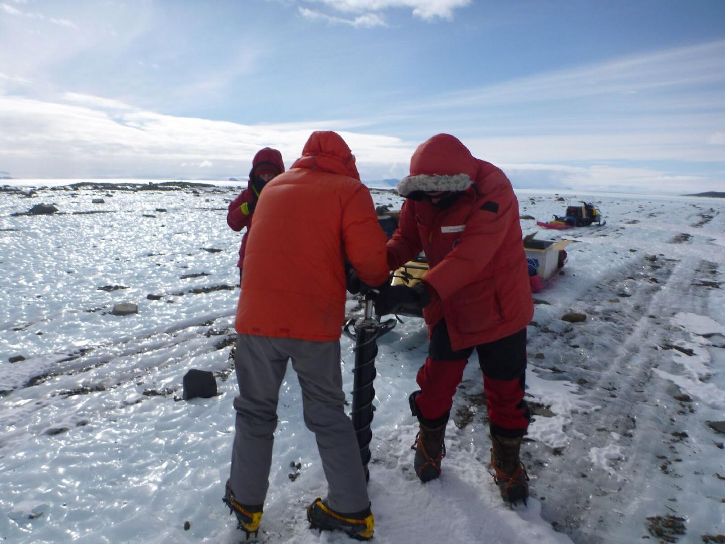 Team Members Taking a Short Ice Core Sample