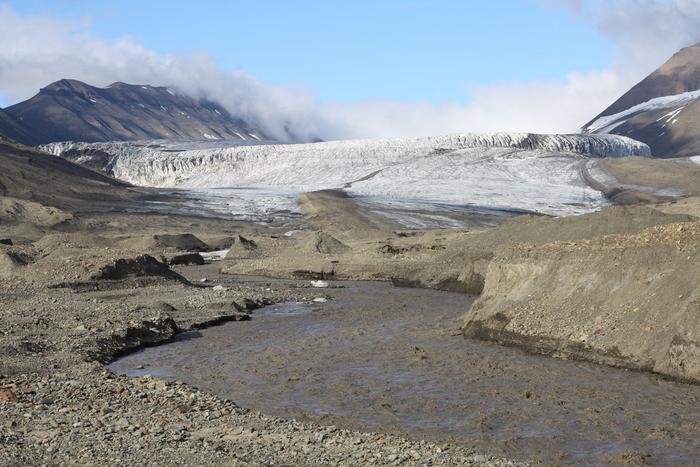 Melt river flows from the terminus of Vallåkrabreen.