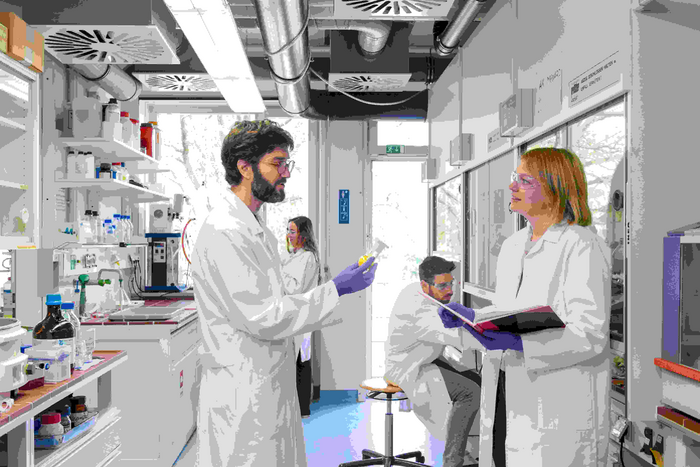 Group Leader in Chemical Proteomics, Dr. Guillaume Médard, and his research group in the lab.